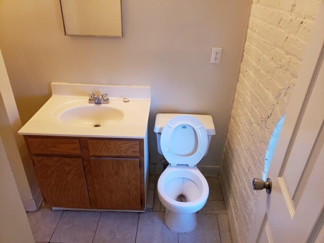 a bathroom with a toilet and a sink